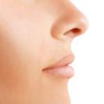 Part of face with no make-up isoalted on white